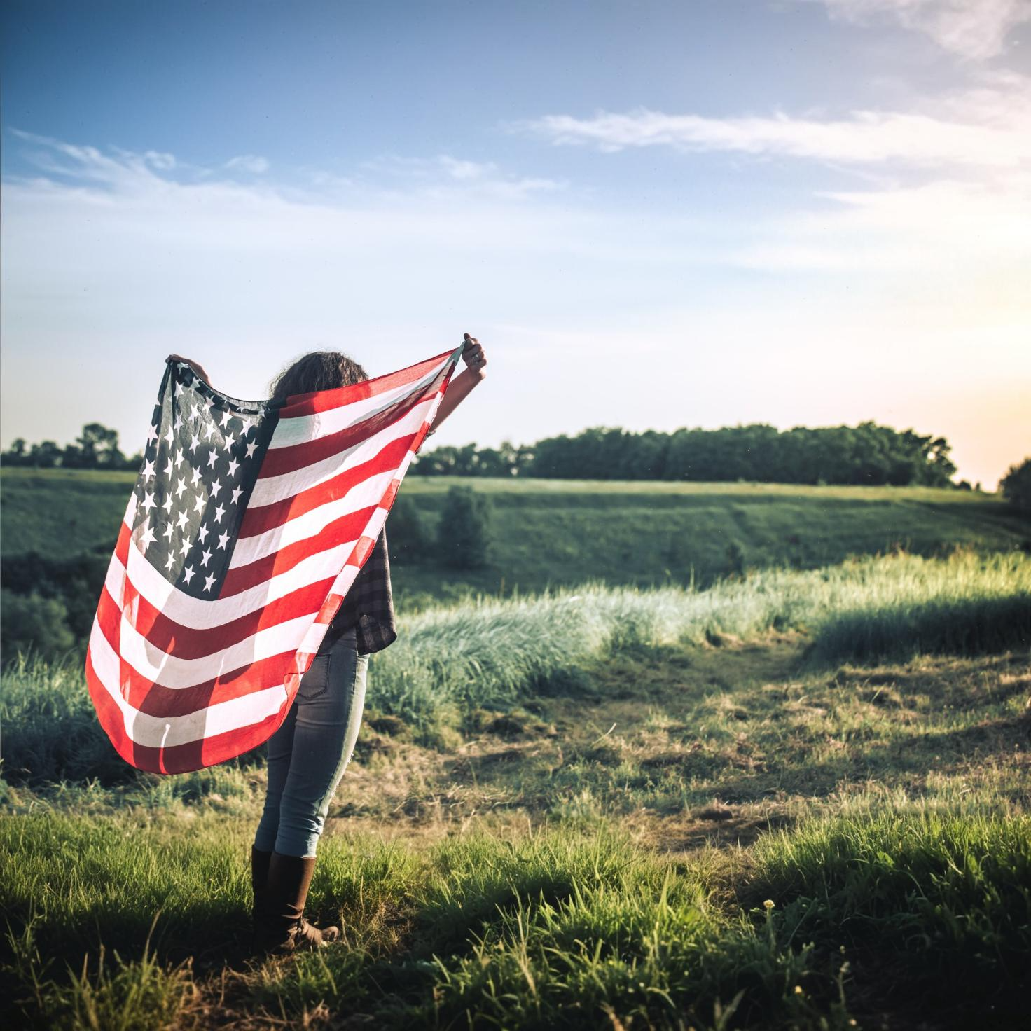 Coming to America, woman holding US flag